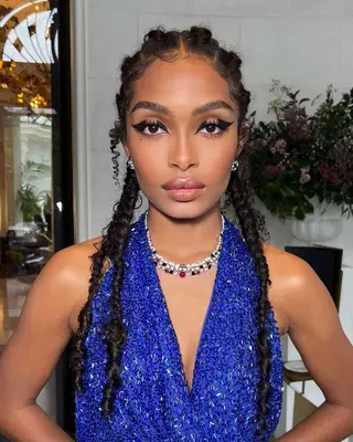 Tamera Mowry wearing a top jumbo knot hairtsyle