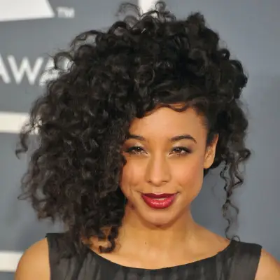 Corinne Bailey Rae wearing her curls in a sideswept style