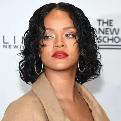 Rihanna wearing a short, wet curly hairstyle