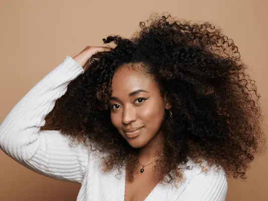 Close up of woman with curly hair