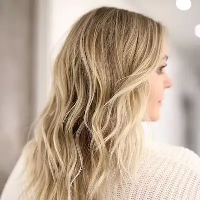 Back of woman with blonde, wavy hair