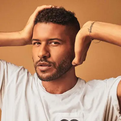 Jeffrey Boyer Chapman with a cropped curly cut 