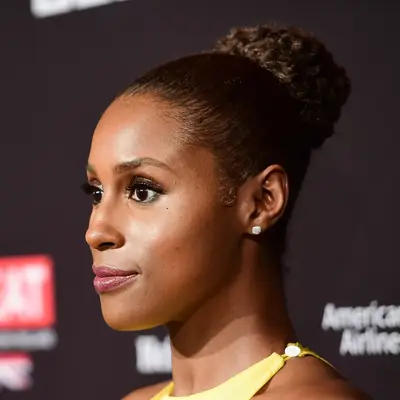 Issa Rae wearing a sleek high bun