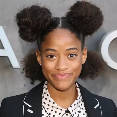 Person wearing two jumbo afro puffs