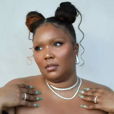 Lizzo wearing space buns