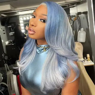 Megan Thee Stallion wearing a light blue wig