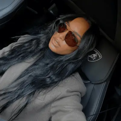 Sandra Oh with wavy hair and bangs