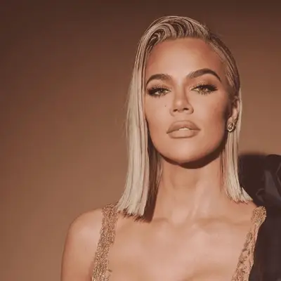 Khloe Kardashian with shoulder length side swept hair