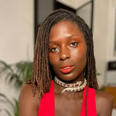 Jodie Turner Smith with shoulder length dreadlocs