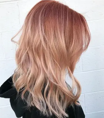 copper hair colours: model with peach hair