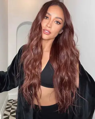 Shay Mitchell with long cowboy copper hair