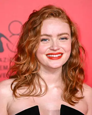 Person at an event posing for the camera, smiling