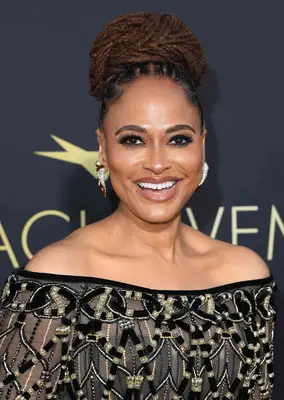 Ava Duvernay wearing her locs in an elegant top bun