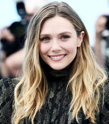 Elizabeth Olson with brown to blonde hair at the 2017 Cannes Film Festival