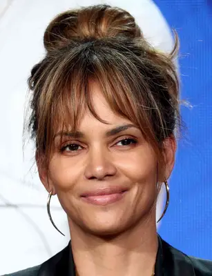Halle Berry with a topknot and bangs