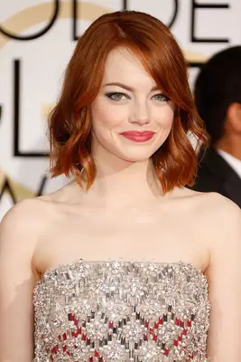 Emma Stone in 2015 with a bright red bob.