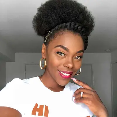 Woman with afro puff updo and twisted headband detail