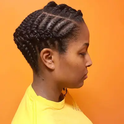 Side view of woman with twisted, braided updo hairstyle
