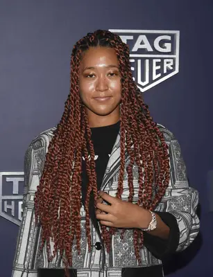 Naomi Osaka with red passion twists