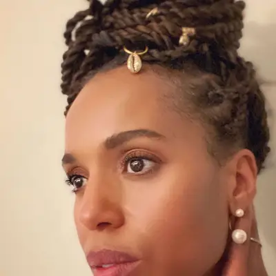 Kerry Washington wears a twisted updo hairstyle with gold shell charm