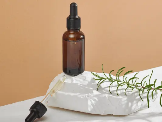 A dropper bottle and a dropper that