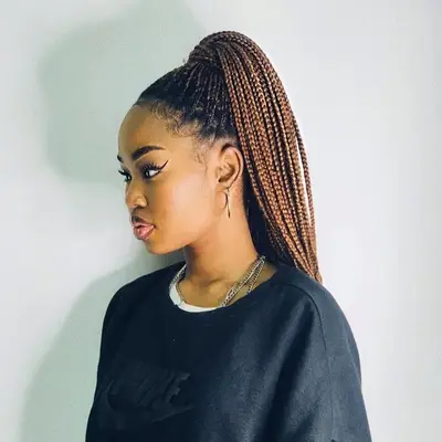 Woman with bronze braided ponytail