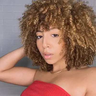 Woman with tawny bronze curls