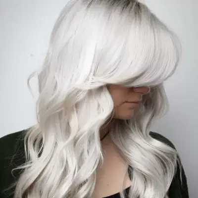 Long white blonde hair with curtain bangs