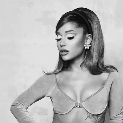 Ariana Grande with 1960s style half up hairstyle