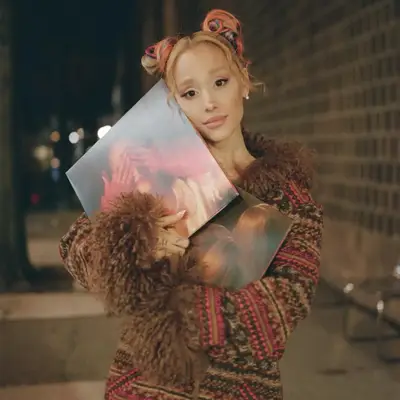 Ariana Grande with pink and blue space buns