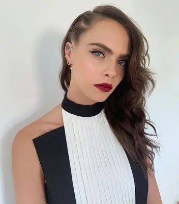 Cara Delevingne wavy hair with side braids