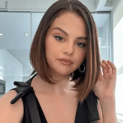 Selena Gomez with a rounded bob and brown lipstick