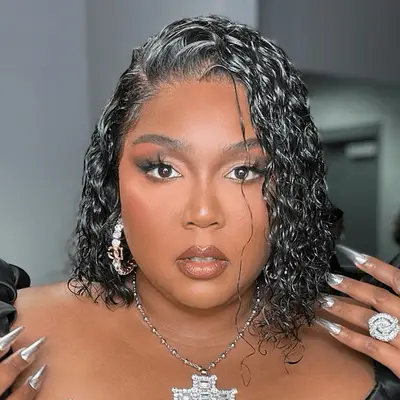 Lizzo in a wavy wet look bob