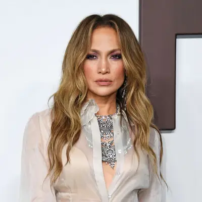 Jennifer Lopez with loose waves attends the Ralph Lauren SS24 runway show