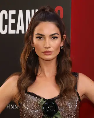 Lily Aldridge with long wavy half-up, half-down hairdo