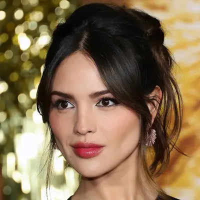 Eiza Gonzalez with messy updo attends the Global Premiere Screening of 