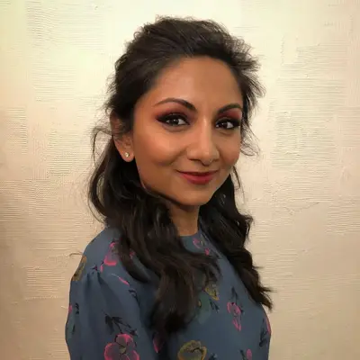 Woman with messy half up half down hairstyle