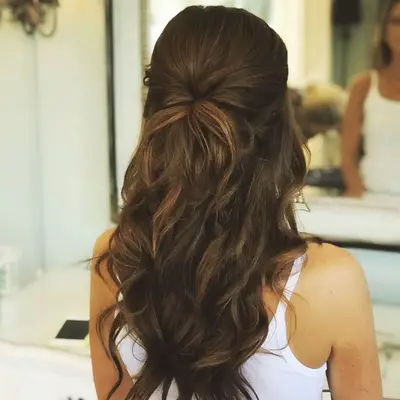 Half-up twisted bridal hairstyle viewed from back