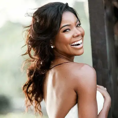 Gabrielle Union wears a side-swept, tousled loose updo
