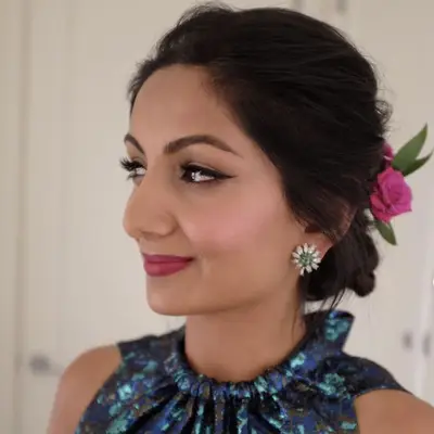 Woman with low bun and pink flowers