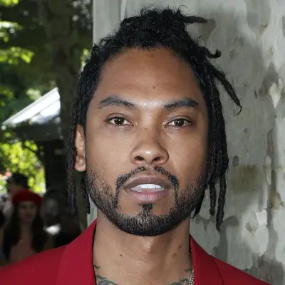 Miguel wears a layered loc hairstyle at Paris Fashion Week Men