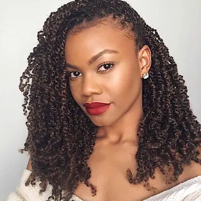 Woman with side-swept mid-length passion twists