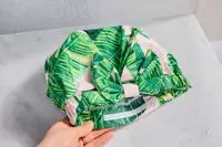 Kitsch Satin-Lined Luxury Shower Cap on a bathroom counter