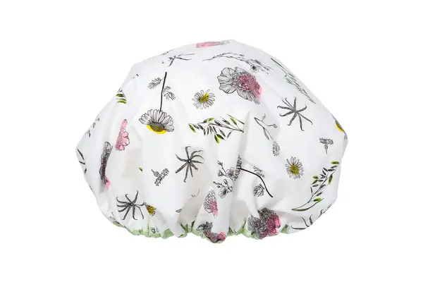 A pink SHHHOWERCAP on a bathroom counter