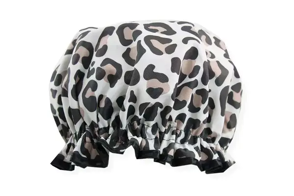 A pink SHHHOWERCAP on a bathroom counter