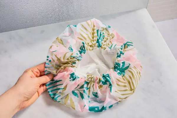 EcoTools Shower Cap on a bathroom counter