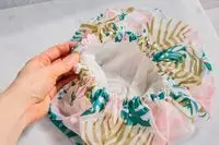 EcoTools Shower Cap on a bathroom counter