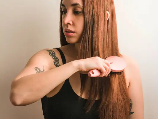 woman brushing hair