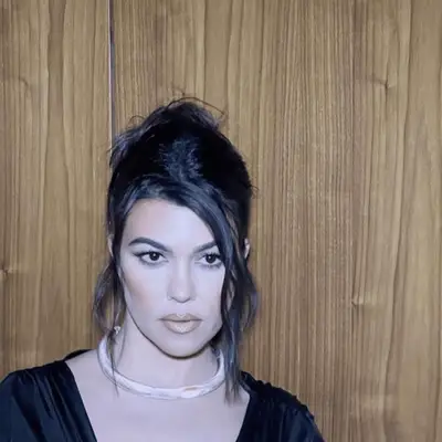 Kourtney Kardashian with a textured updo