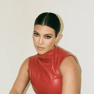 Kourtney Kardashian With a center parted updo